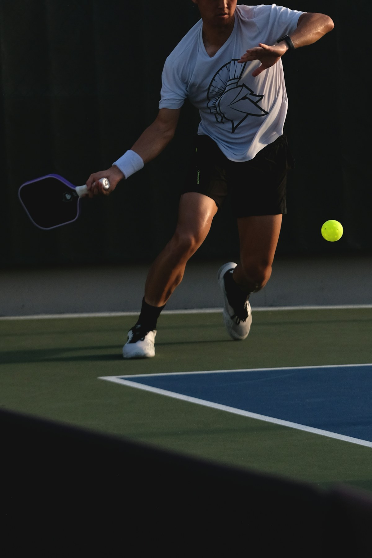 Pickleball player getting ready to return a shot